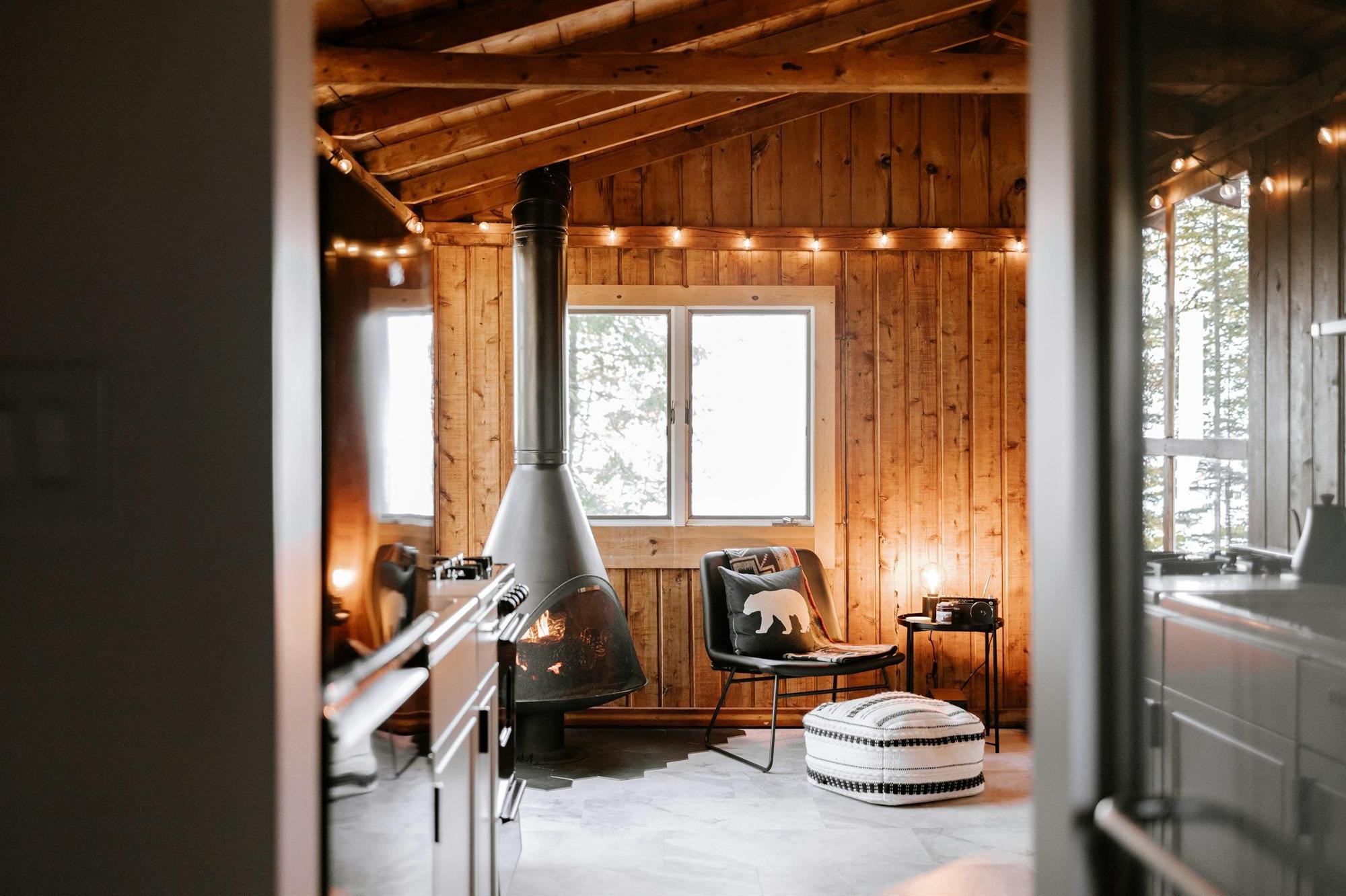 A quiet living room with a fireplace and a reading chair